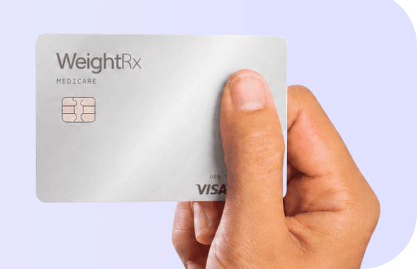 Hand holding a WeightRx Medicare access card