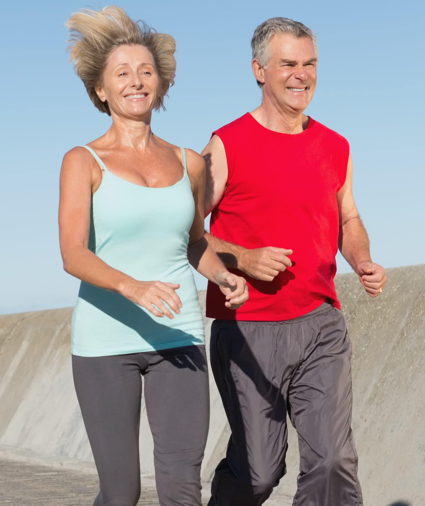 A couple jogging together outdoors